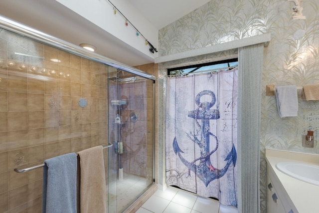 bathroom featuring vanity, a shower with door, and tile patterned flooring