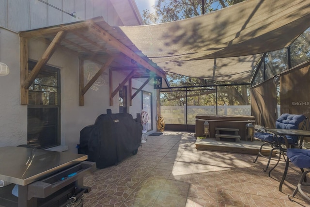 view of patio featuring area for grilling and a hot tub