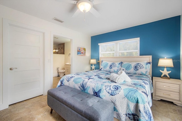 bedroom featuring ceiling fan and ensuite bath