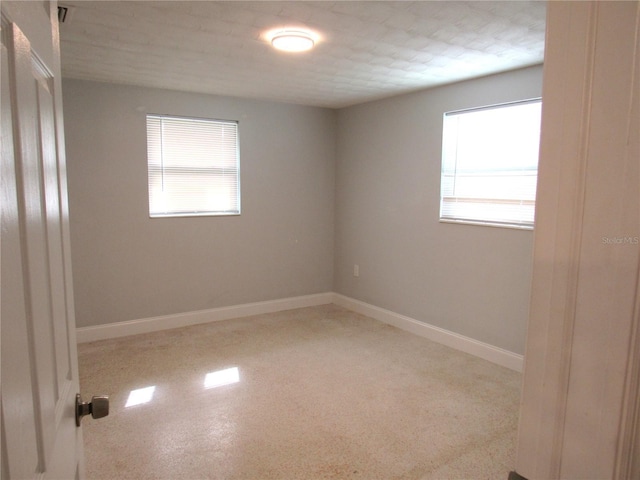 spare room featuring plenty of natural light