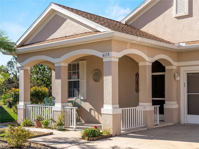 doorway to property featuring a porch