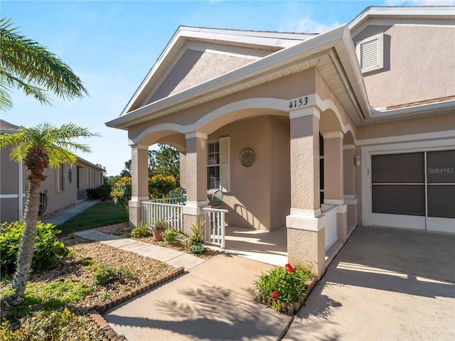 view of front of house featuring a porch and a garage