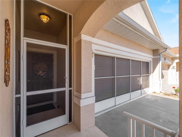 doorway to property featuring a garage