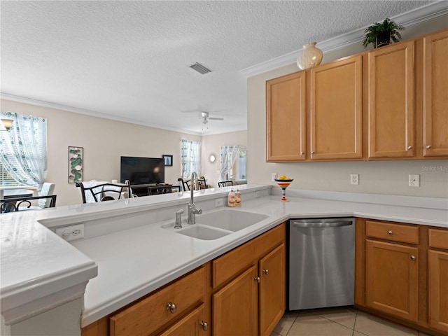 kitchen with sink, light tile patterned floors, dishwasher, a textured ceiling, and kitchen peninsula