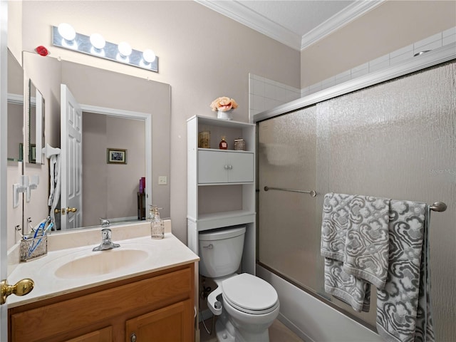 full bathroom featuring shower / bath combination with glass door, ornamental molding, toilet, and vanity