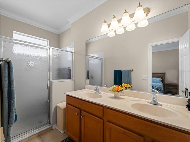 bathroom with tile patterned flooring, vanity, crown molding, and a shower with door