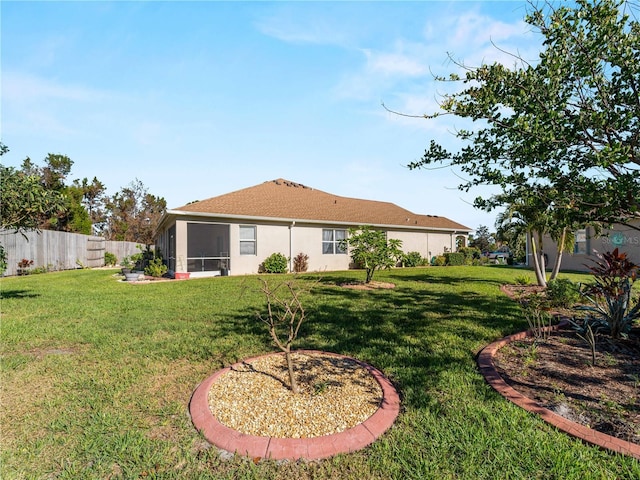 back of property featuring a lawn