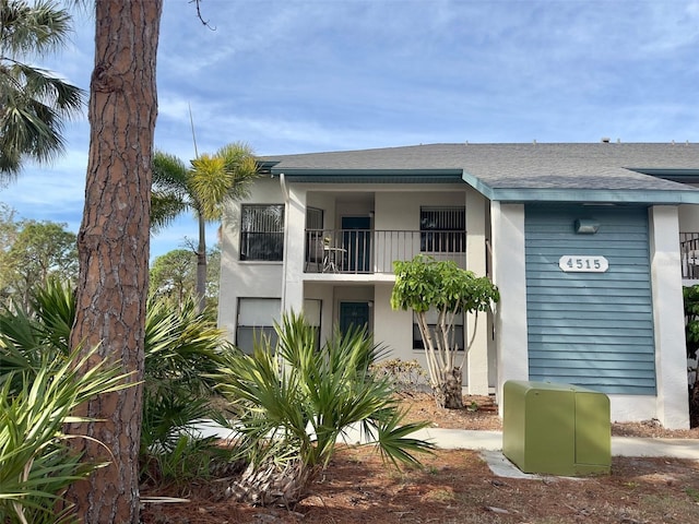 rear view of house with a balcony