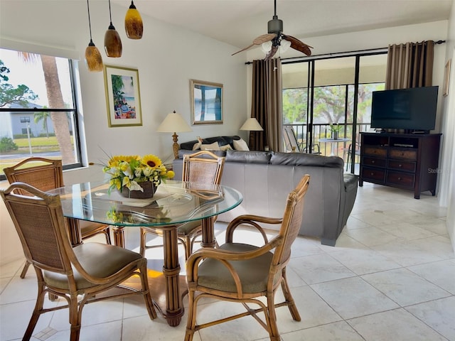 tiled dining area featuring ceiling fan