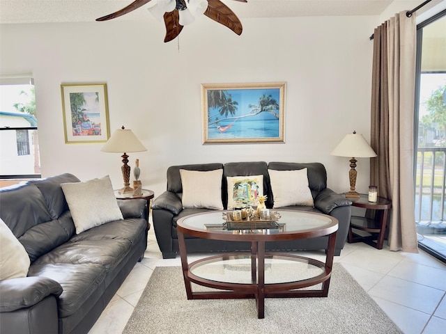 tiled living room featuring ceiling fan