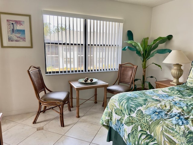 bedroom with light tile patterned floors