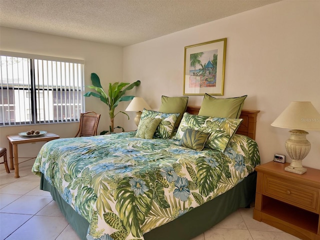 tiled bedroom with a textured ceiling