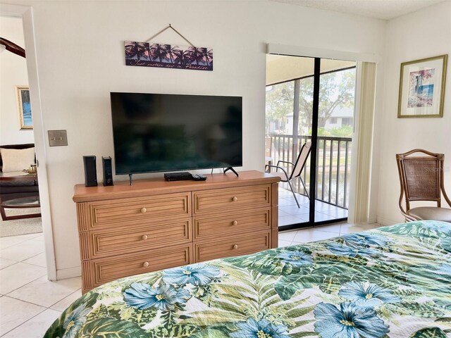 bedroom featuring light tile patterned flooring and access to outside