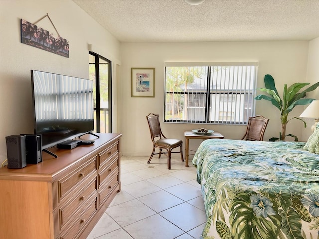 tiled bedroom with a textured ceiling