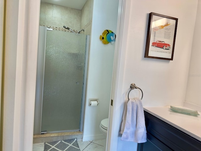 bathroom with walk in shower, vanity, toilet, and tile patterned flooring