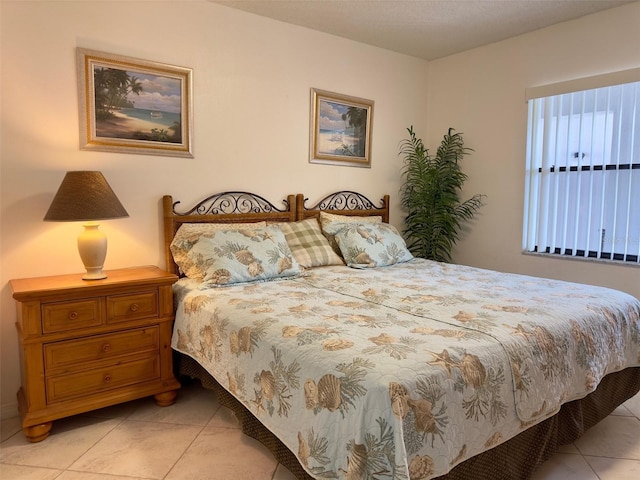 bedroom with light tile patterned flooring