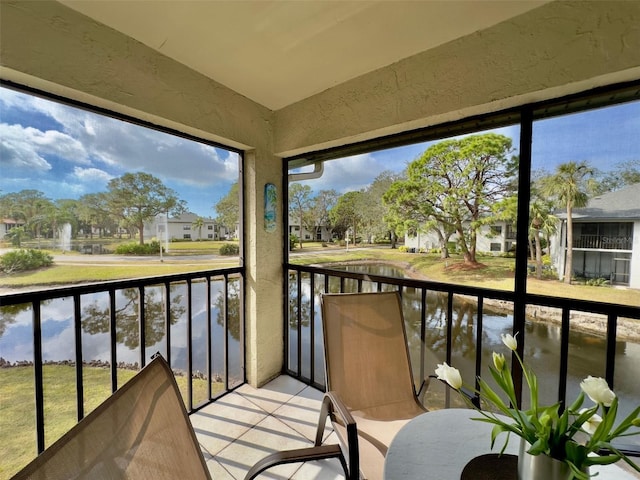 sunroom with a water view