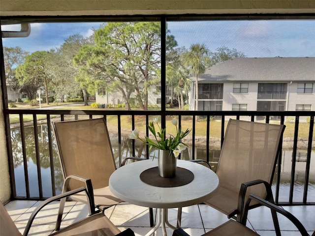 balcony featuring a water view