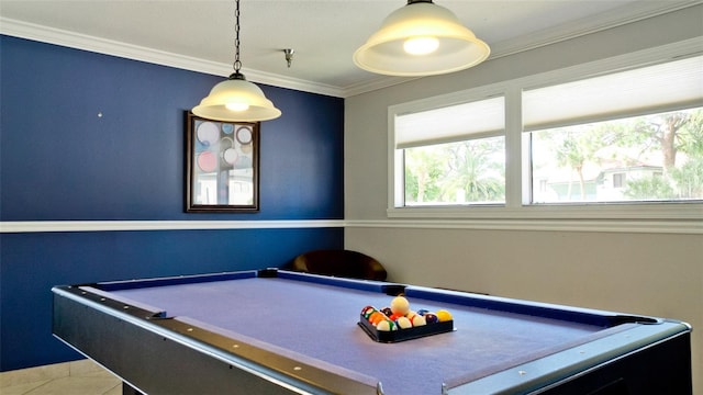 recreation room with pool table, ornamental molding, and tile patterned flooring