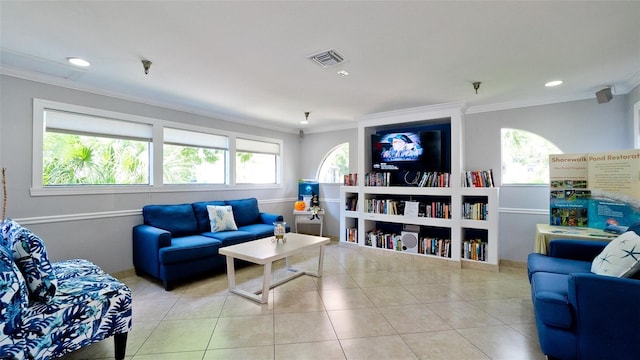 living room with crown molding and light tile patterned floors