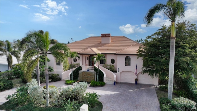 mediterranean / spanish house featuring a garage