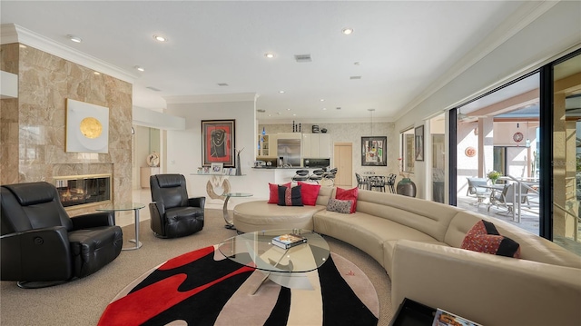 living room featuring crown molding, a high end fireplace, and carpet