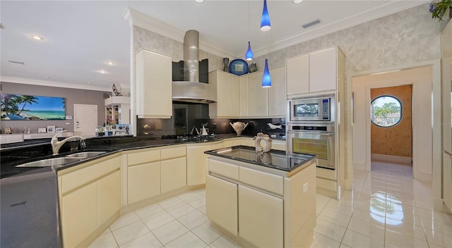 kitchen featuring sink, decorative light fixtures, a center island, ornamental molding, and stainless steel appliances