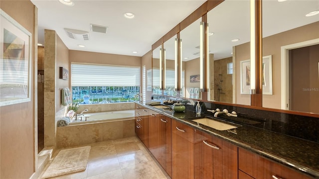 bathroom featuring vanity and plus walk in shower