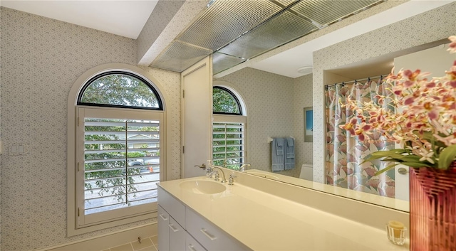 bathroom featuring plenty of natural light and vanity