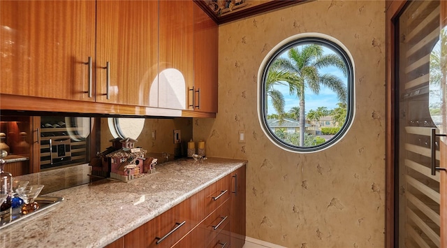 bar featuring light stone countertops