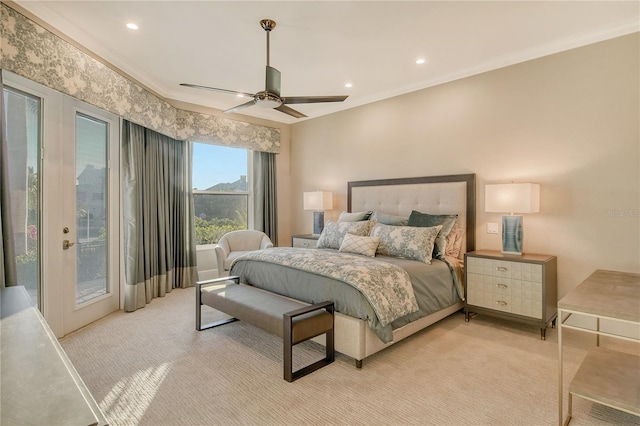 bedroom featuring crown molding, light colored carpet, access to exterior, and ceiling fan