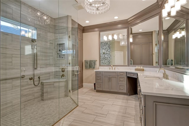 bathroom with an enclosed shower, vanity, and ornamental molding