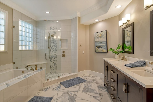 bathroom featuring crown molding, vanity, and shower with separate bathtub