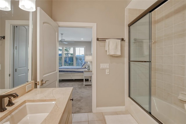 bathroom featuring tile patterned flooring, vanity, combined bath / shower with glass door, and ceiling fan