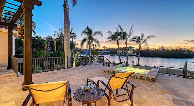 400 N Washington Dr, Sarasota, FL 34236 - view of patio / terrace featuring an in-ground hot tub and a water view