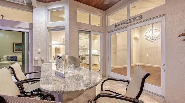 400 N Washington Dr, Sarasota, FL 34236 - office area with a textured wall and a chandelier