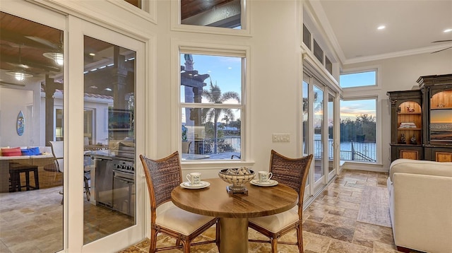 400 N Washington Dr, Sarasota, FL 34236 - dining space with ornamental molding, stone tile flooring, and recessed lighting