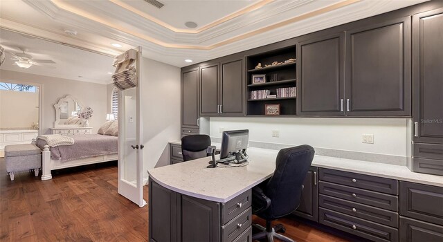 400 N Washington Dr, Sarasota, FL 34236 - office with ornamental molding, a ceiling fan, dark wood-style flooring, built in desk, and a tray ceiling
