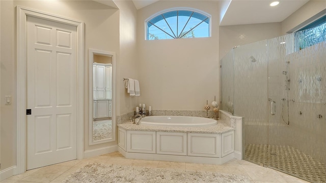 400 N Washington Dr, Sarasota, FL 34236 - full bathroom with a shower stall, a bath, and tile patterned floors