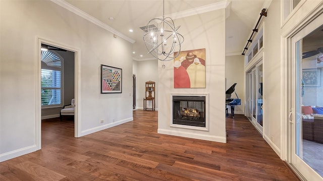 400 N Washington Dr, Sarasota, FL 34236 - unfurnished living room featuring crown molding, dark wood-style floors, baseboards, a chandelier, and recessed lighting