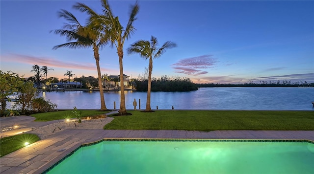 400 N Washington Dr, Sarasota, FL 34236 - pool at dusk with a water view, a lawn, and an outdoor pool