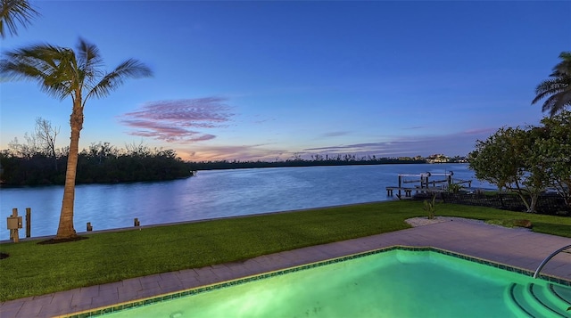 400 N Washington Dr, Sarasota, FL 34236 - pool at dusk with a water view, a yard, and an outdoor pool