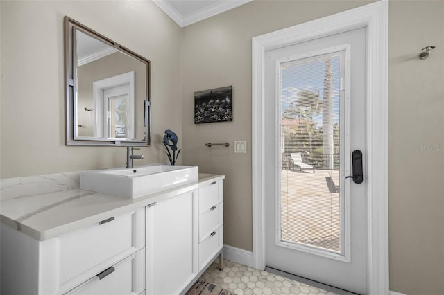 400 N Washington Dr, Sarasota, FL 34236 - bathroom featuring ornamental molding, vanity, and baseboards
