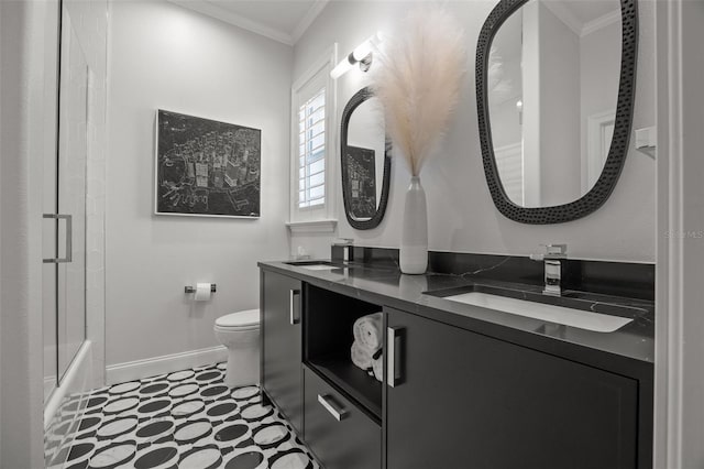400 N Washington Dr, Sarasota, FL 34236 - full bath featuring crown molding, baseboards, double vanity, toilet, and tile patterned floors