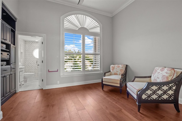 400 N Washington Dr, Sarasota, FL 34236 - sitting room featuring crown molding, baseboards, and wood finished floors