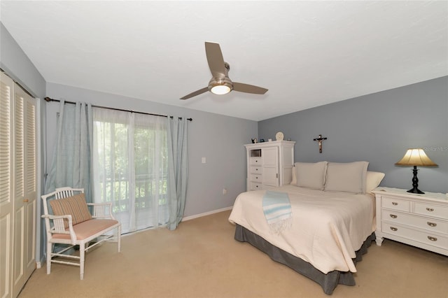 bedroom with ceiling fan, access to exterior, and light carpet