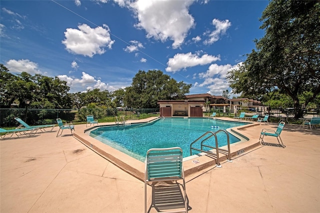 view of swimming pool featuring a patio