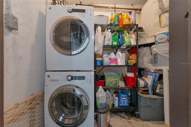 laundry area with stacked washer and dryer