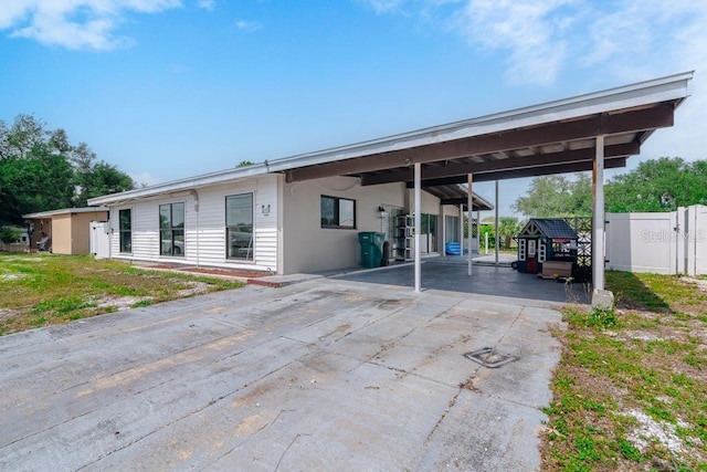 exterior space featuring a carport