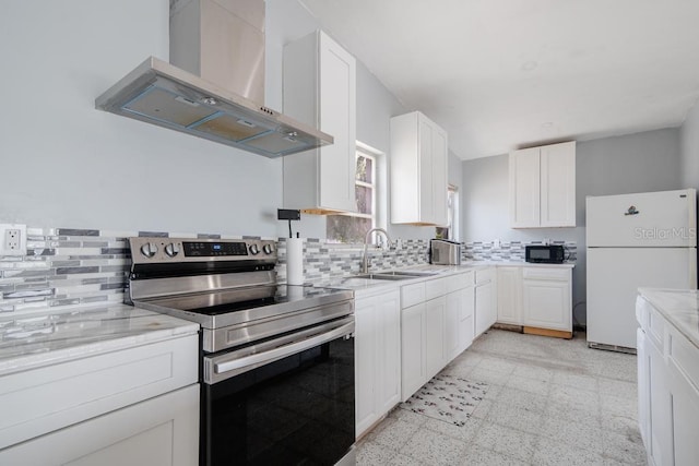 kitchen with electric stove, sink, ventilation hood, white cabinets, and white fridge